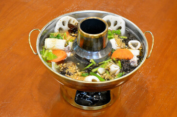 Chinese seaweed with seafood and vegetables in hot pot, Clear soup