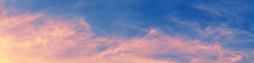Colorful cloudy sky at sunset. Gradient color. Sky texture. Horizontal banner