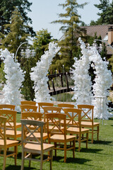 Modern stylish Wedding ceremony decorations. Wild flowers. The wedding decor. The pastel colors flowers bouquet. Natural beautiful wedding decorations. Minimalistic wedding decorations