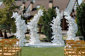 Modern stylish Wedding ceremony decorations. Wild flowers. The wedding decor. The pastel colors flowers bouquet. Natural beautiful wedding decorations. Minimalistic wedding decorations