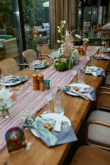 Modern stylish wedding table setting. Fairytale wedding decoration. Vibrant colors, vintage style. The pastel colors flowers bouquet. Natural beautiful wedding table setting  