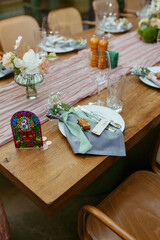 Modern stylish wedding table setting. Fairytale wedding decoration. Vibrant colors, vintage style. The pastel colors flowers bouquet. Natural beautiful wedding table setting  