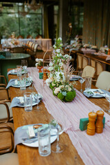 Modern stylish wedding table setting. Fairytale wedding decoration. Vibrant colors, vintage style. The pastel colors flowers bouquet. Natural beautiful wedding table setting  
