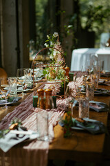 Modern stylish wedding table setting. Fairytale wedding decoration. Vibrant colors, vintage style. The pastel colors flowers bouquet. Natural beautiful wedding table setting  