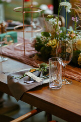 Modern stylish wedding table setting. Fairytale wedding decoration. Vibrant colors, vintage style. The pastel colors flowers bouquet. Natural beautiful wedding table setting  