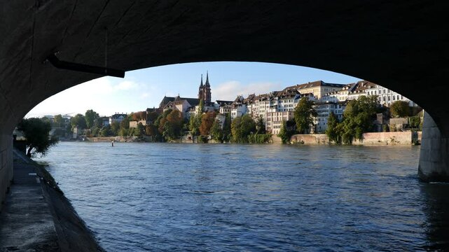 Basel city skyline in Switzerland, view from under the Middle Bridge (Mittlere Brucke) across Rhine River.