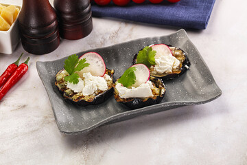 Grilled eggplant with cheese and radish