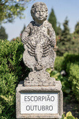 Obraz premium Stone statue depicting the scorpio, october sign belonging to the episcopal garden of the city of Castelo Branco-Portugal.