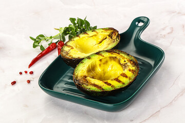 Sliced fresh avocado on the grill