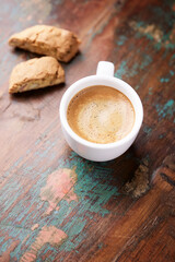 Cup of coffee and Cantuccini (Italian cookies) on dark wooden background. Copy space.