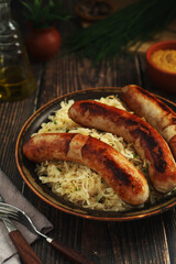 	
A bowl with Bratwurst and Sauerkraut as side dish - traditional German food
