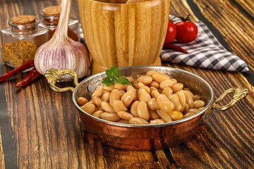 Baked white canned beans in the bowl
