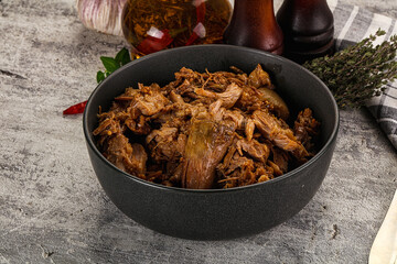 Shredded slow cooked pork meat