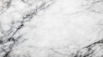 Fototapeta premium Polished white marble surface with subtle gray veining, ideal for backgrounds or textures in design projects.
