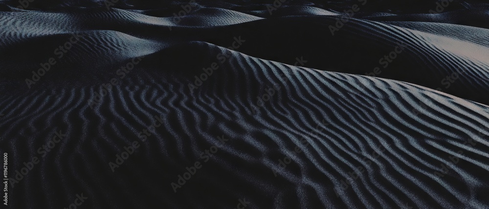 Poster textures of fine black sand creating an arid landscape in a desert environment at twilight