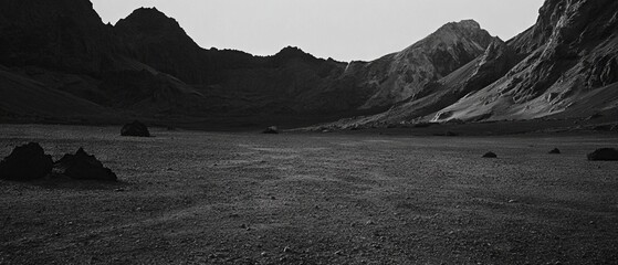 Volcanic ash creates a dramatic texture in a desolate landscape showcasing black mountains