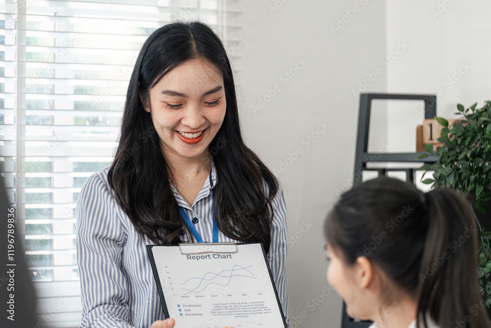 Poster business professional sharing a report chart with a colleague in an office setting