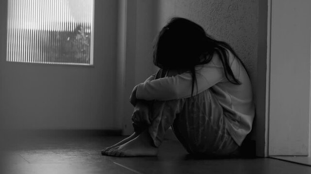 Sad Lonely Child in Moody Gloomy Dark Scene at Home Corridor, Covering Face in Anxiety and Depression