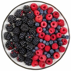 A platter of assorted berries including raspberries, blueberries, and strawberries