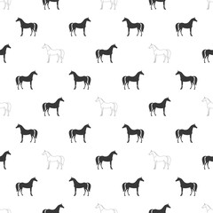 Seamless pattern of alternating black and white arabian horse silhouettes on a white background, creating a minimalist equestrian design
