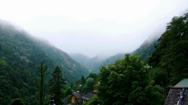 Misty Mountain Valley- A Tranquil View of a mist covered valley surounded by towering mountains.