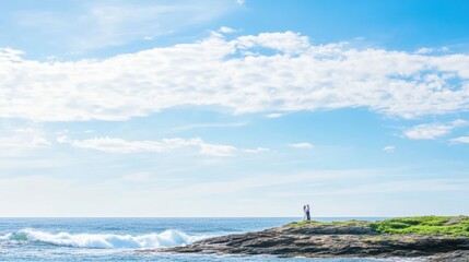 Fototapeta premium Bride and groom with crazy socks on rocky outcrop by the sea - unique wedding moment in nature