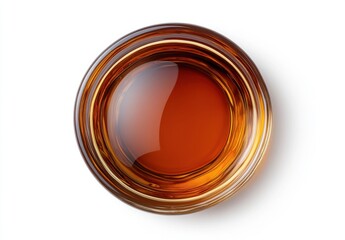 Close-Up View of Golden Brown Liquid in a Glass Bowl on White Background, Showcasing the Rich Color and Texture of the Liquid Inside, Perfect for Culinary and Beverage Related Themes