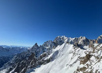 Fotobehang Mont Blanc massif towering over snowy landscape in Courmayeur, Italy © Antonio Gravante