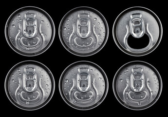 Six beer or soft drink cans from above, one emptied