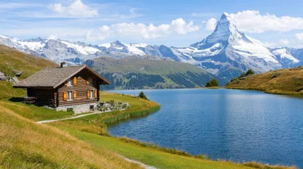 Papier peint photo Villes / Voyage Serene cabin overlooking scenic lake and mountains swiss alps  © Nattapol
