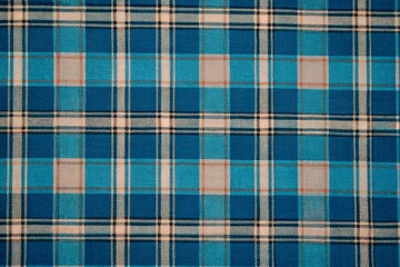 Fototapeta premium Classic Blue Tartan Plaid Textile fabric Pattern with Beige, White, and Black Lines in Traditional Scottish Style