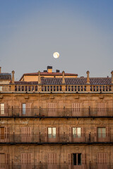 Full Moon Above the Baroque Facade of Plaza Mayor in Salamanca at Daw