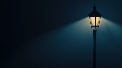Nighttime Illuminated Street Lamp Post Glowing in Dark Fog