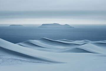 Serene Arctic landscape featuring snow-covered dunes, distant islands, and a tranquil ocean under a cloudy sky.  A minimalist, peaceful scene perfect for travel, nature, and winter themes.