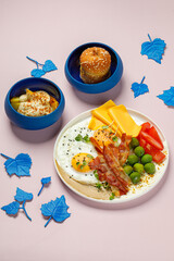 Vibrant Morning Feast with Eggs, Bacon, and Fresh Sides