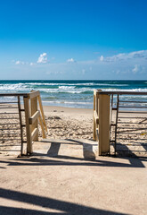 A wooden staircase leading down to the sandy beach of the Mediterranean Sea invites you to immerse yourself in an atmosphere of privacy and tranquility, with views of the endless horizon and the waves