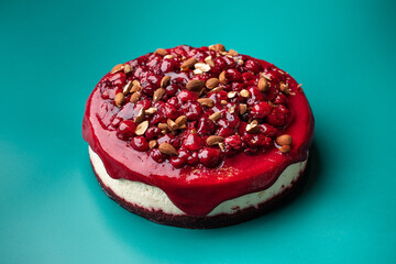 Red cheesecake with berries and nuts