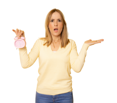 Young amazed woman in casual sweater showing alarm clock isolated over transparent background. PNG transparent