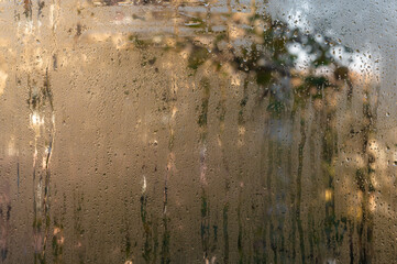 brown wet glass background with water drops
