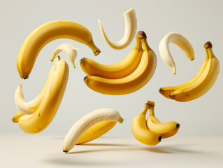 Various falling fresh ripe banana on light white background, horizontal composition