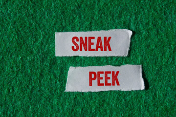 Sneak peek message written on ripped torn paper pieces on green background. Conceptual sneak peek...