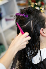 Fototapeta premium Hair treatment session in a salon with expert styling techniques