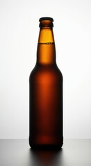 Bottle mockup. Amber beer bottle silhouetted against a light background
