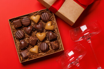 A glasses of champagne elegantly paired with a gift box