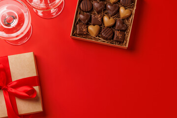 A glasses of champagne elegantly paired with a box of rich chocolates