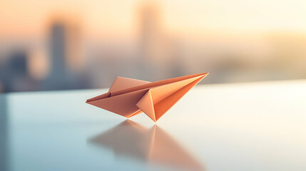 A conceptual image of a paper airplane on a clean surface symbolizing business innovation