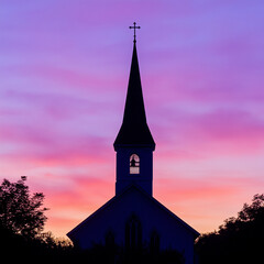 Obraz premium Dramatische Silhouette einer Kirche vor einem farbenfrohen Sonnenuntergang