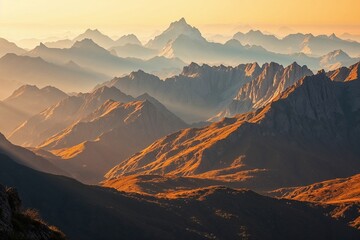 Obraz premium Majestic mountain range at sunrise with golden light