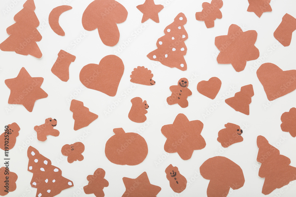 Wall mural pattern of brown different gingerbread cookie shapes from application paper on light gray table back