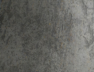 Highresolution image showcasing a dark grey, textured surface with subtle gold flecks. Ideal for backgrounds, website design, or adding a sophisticated, industrial feel to your projects.